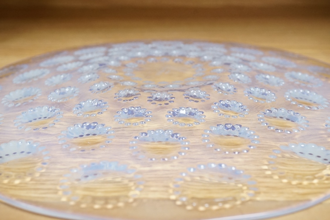 A Lalique Asters coupe-ouverte glass dish, etched R. Lalique France to the base, 28cm in diameter